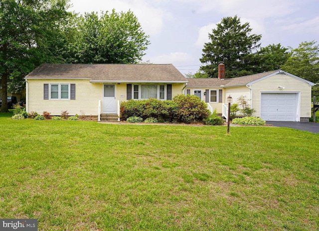 407 Elizabeth St, Georgetown, DE 19947 - ranch-style home featuring an attached garage, asphalt driveway, entry steps, and a front yard