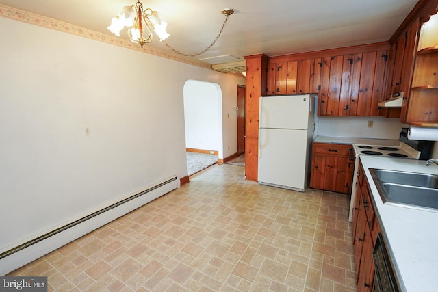 407 Elizabeth St, Georgetown, DE 19947 - kitchen with white appliances, arched walkways, a baseboard radiator, brick patterned floors, and brown cabinetry