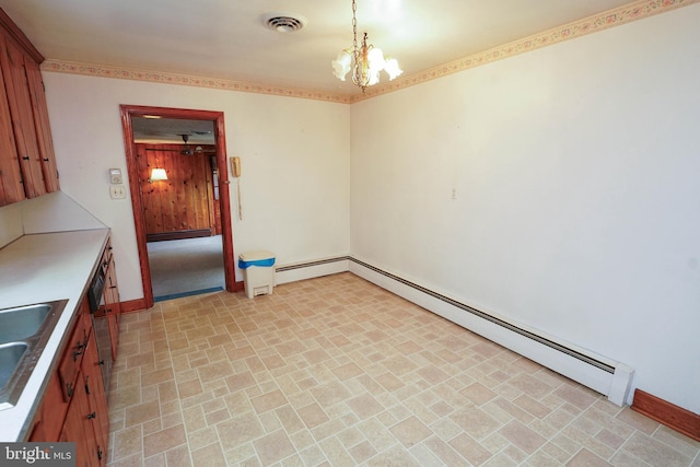 407 Elizabeth St, Georgetown, DE 19947 - unfurnished dining area featuring a baseboard heating unit, baseboards, a chandelier, and a sink