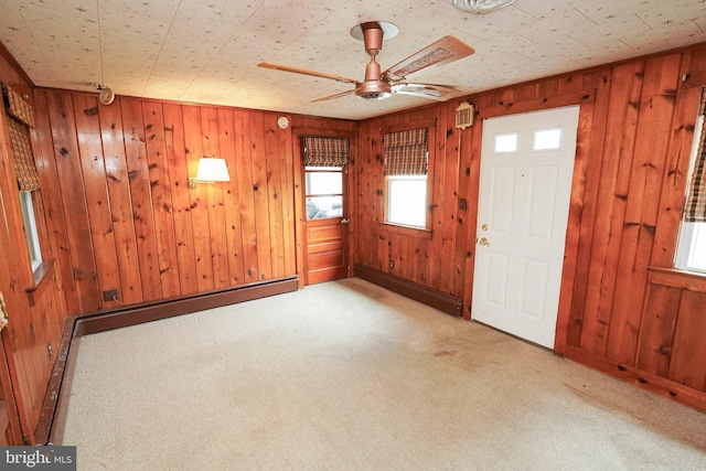 407 Elizabeth St, Georgetown, DE 19947 - carpeted entryway featuring wood walls and ceiling fan