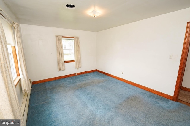 407 Elizabeth St, Georgetown, DE 19947 - carpeted empty room with baseboards and baseboard heating