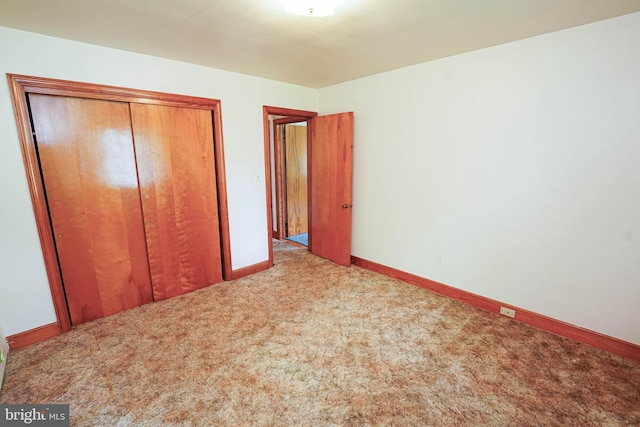 407 Elizabeth St, Georgetown, DE 19947 - unfurnished bedroom with a closet, carpet floors, and baseboards