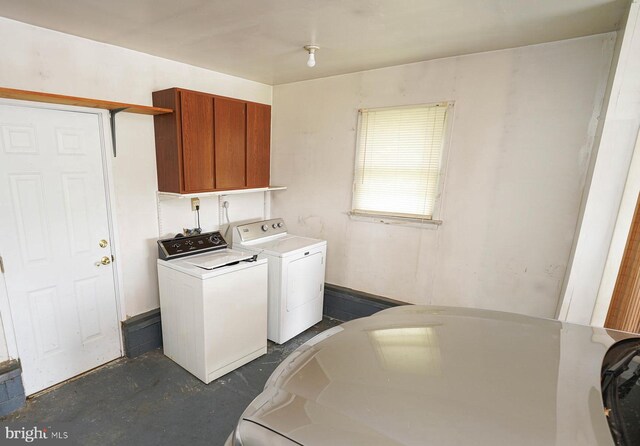 407 Elizabeth St, Georgetown, DE 19947 - laundry room with washer and dryer and cabinet space