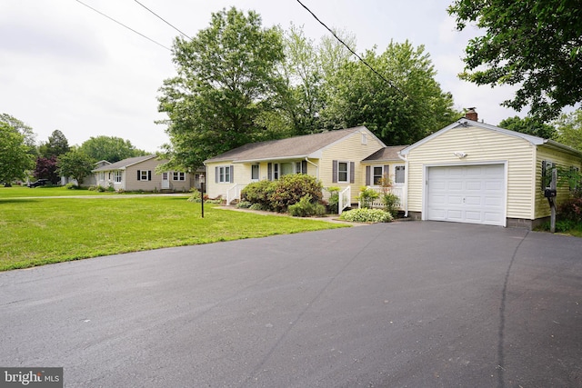 407 Elizabeth St, Georgetown, DE 19947 - ranch-style home with a garage, driveway, a front lawn, and a chimney