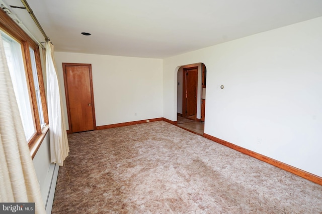 407 Elizabeth St, Georgetown, DE 19947 - unfurnished room with carpet, arched walkways, healthy amount of natural light, and baseboards