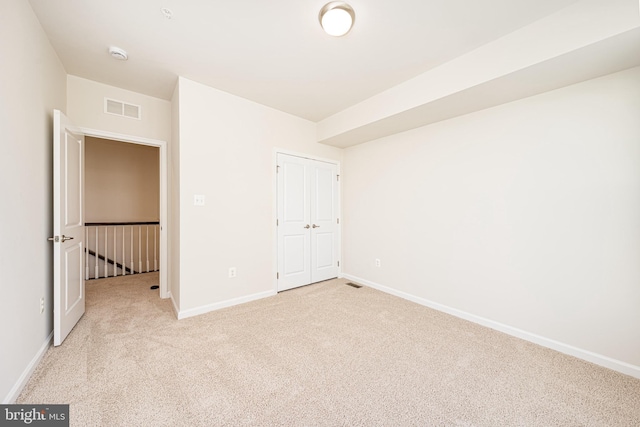 5831 Rochefort St, Ijamsville, MD 21754 - unfurnished bedroom with light colored carpet, baseboards, and a closet