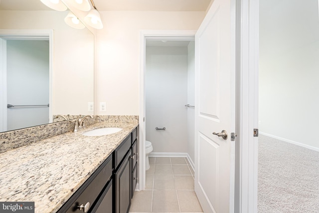 5831 Rochefort St, Ijamsville, MD 21754 - bathroom featuring toilet, vanity, baseboards, and tile patterned floors