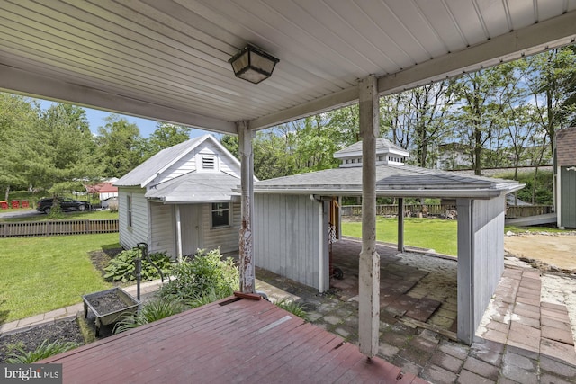 deck featuring a gazebo, an outdoor structure, and a patio area