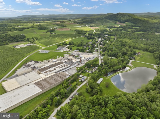 aerial view of property and surrounding area featuring a water and mountain view and rural landscape