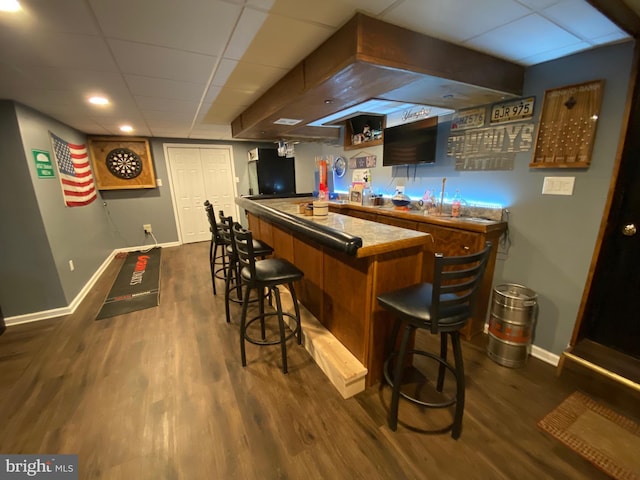 4 Tall Oaks Dr, Pottsville, PA 17901 - indoor bar with baseboards, dark wood finished floors, and a paneled ceiling
