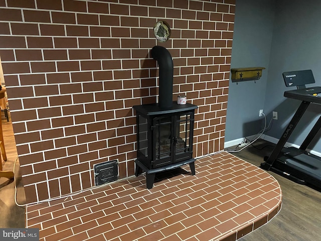 4 Tall Oaks Dr, Pottsville, PA 17901 - detailed view of a wood stove and baseboards
