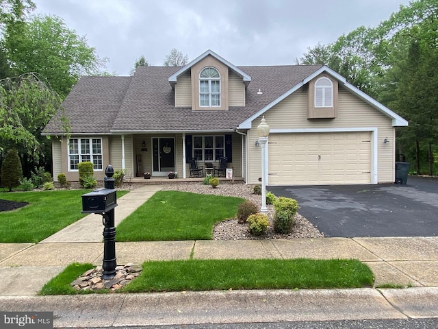 4 Tall Oaks Dr, Pottsville, PA 17901 - traditional-style house with a porch, driveway, an attached garage, a front yard, and roof with shingles