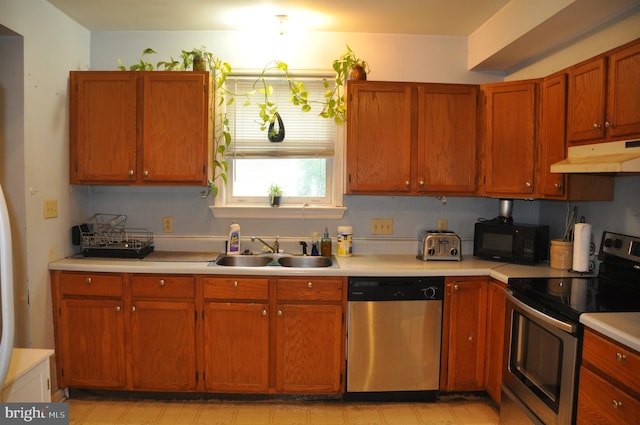 2147 Cloverleaf Rd, Mount Joy, PA 17552 - kitchen with appliances with stainless steel finishes, under cabinet range hood, a sink, and light countertops
