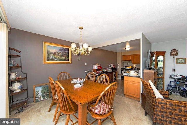 dining area featuring a chandelier and light colored carpet