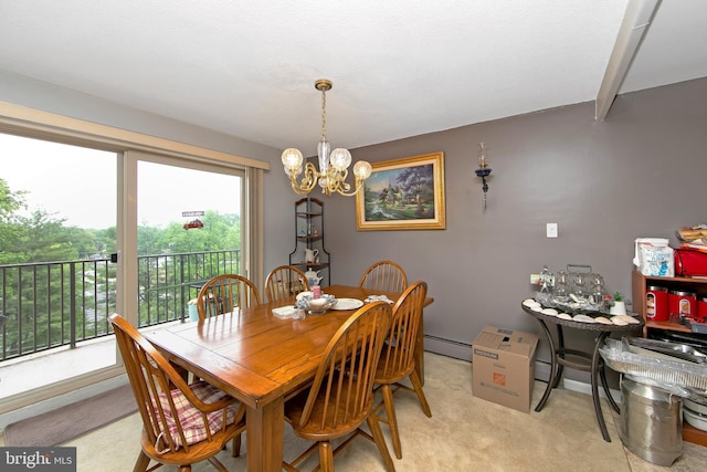 dining room with a chandelier, a baseboard radiator, and light colored carpet