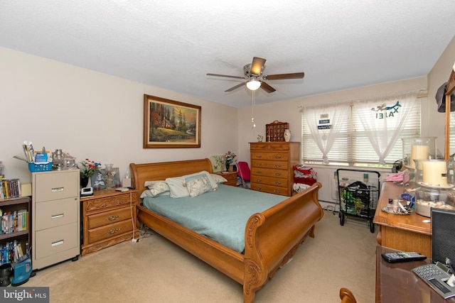 bedroom with light carpet and ceiling fan
