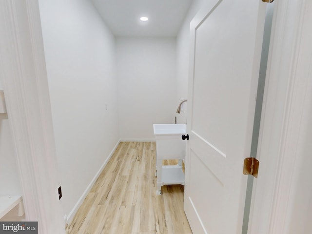 294 Meadow Flower Cir, Bellefonte, PA 16823 - laundry room featuring light wood-type flooring, a sink, baseboards, and recessed lighting
