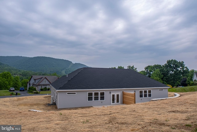 294 Meadow Flower Cir, Bellefonte, PA 16823 - back of house featuring french doors, a shingled roof, and a mountain view