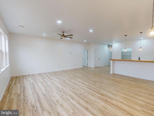294 Meadow Flower Cir, Bellefonte, PA 16823 - unfurnished living room featuring light wood-style floors, ceiling fan, recessed lighting, and baseboards