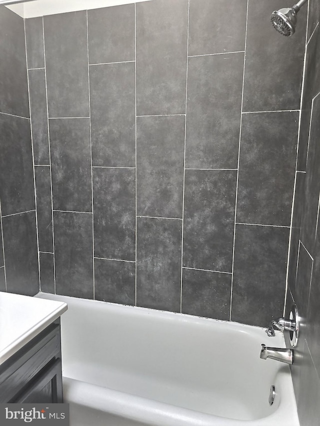 bathroom with vanity and tub / shower combination