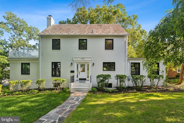 1901 Belle Haven Rd, Alexandria, VA 22307 - view of front of house with brick siding, a front yard, and a chimney