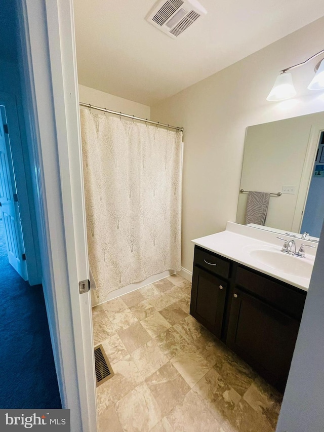 128 Eagle Rd, Dillsburg, PA 17019 - bathroom with vanity, a shower with curtain, and stone finish floors