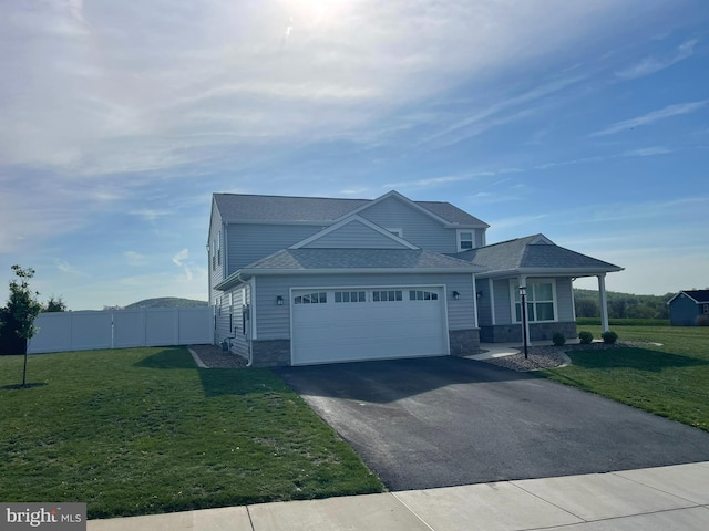 128 Eagle Rd, Dillsburg, PA 17019 - view of front of house featuring asphalt driveway, a garage, covered porch, and a shingled roof