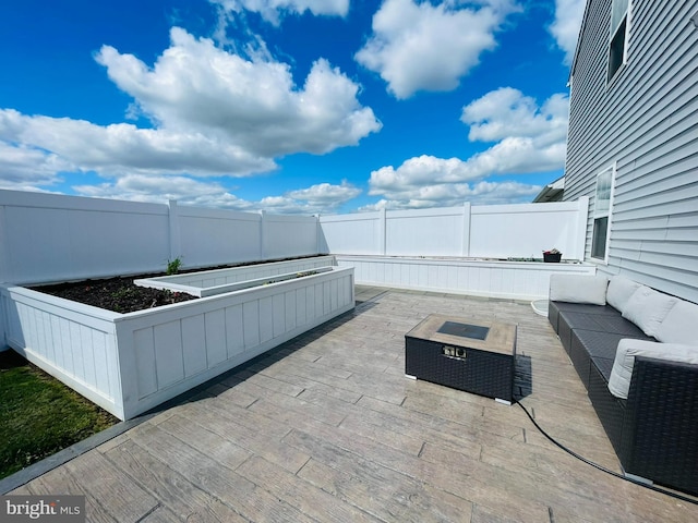 128 Eagle Rd, Dillsburg, PA 17019 - view of patio with an outdoor hangout area, a fenced backyard, and a vegetable garden