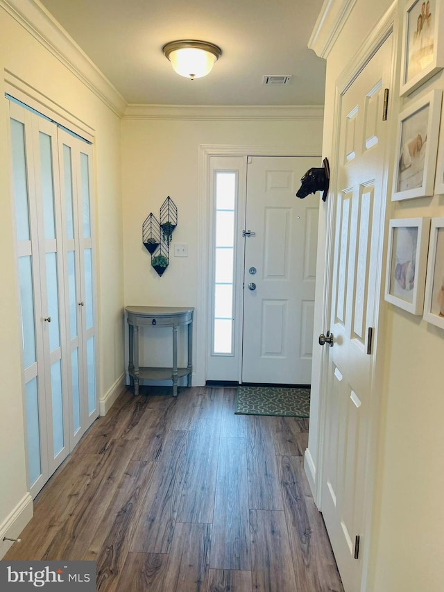 128 Eagle Rd, Dillsburg, PA 17019 - foyer featuring dark wood finished floors, crown molding, and baseboards