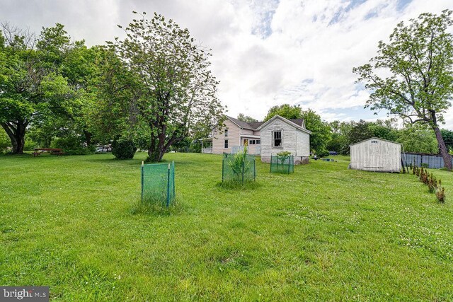 340 Andrews Rd, Strasburg, VA 22657 - view of grassy yard featuring an outdoor structure and a storage shed
