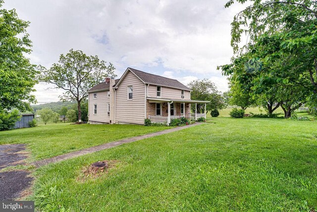 340 Andrews Rd, Strasburg, VA 22657 - back of house featuring covered porch and a yard