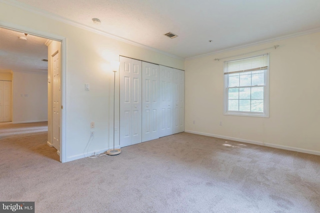 12216 Eagles Nest Ct Unit G, Germantown, MD 20874 - unfurnished bedroom with ornamental molding, carpet floors, baseboards, and a closet
