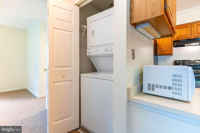 12216 Eagles Nest Ct Unit G, Germantown, MD 20874 - washroom featuring stacked washer / dryer, crown molding, light colored carpet, and baseboards
