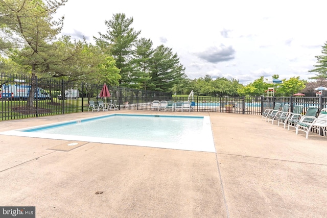 12216 Eagles Nest Ct Unit G, Germantown, MD 20874 - community pool featuring a patio and view of scattered trees