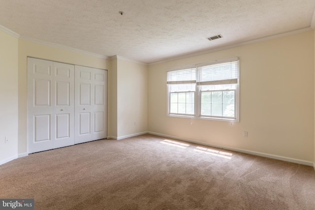 12216 Eagles Nest Ct Unit G, Germantown, MD 20874 - unfurnished bedroom with carpet, crown molding, a closet, baseboards, and a textured ceiling