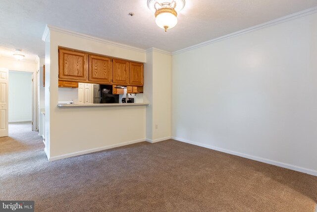 12216 Eagles Nest Ct Unit G, Germantown, MD 20874 - kitchen featuring carpet flooring, ornamental molding, freestanding refrigerator, brown cabinetry, and baseboards