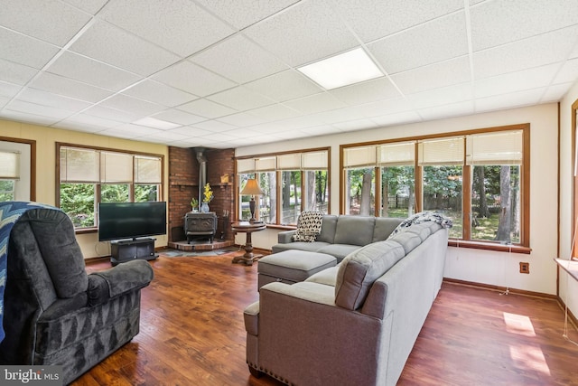 349 Hartford Rd, Mount Laurel, NJ 08054 - living room with a wood stove, plenty of natural light, wood finished floors, and a drop ceiling