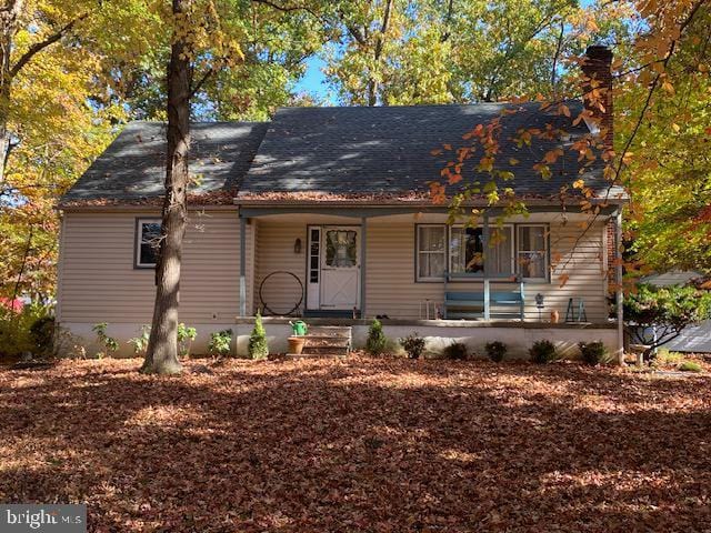 349 Hartford Rd, Mount Laurel, NJ 08054 - view of front facade featuring covered porch and a chimney