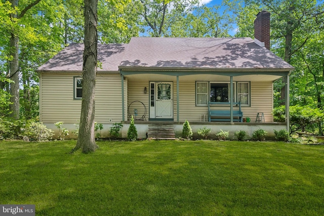349 Hartford Rd, Mount Laurel, NJ 08054 - view of front of house with a chimney, a porch, a front yard, and roof with shingles