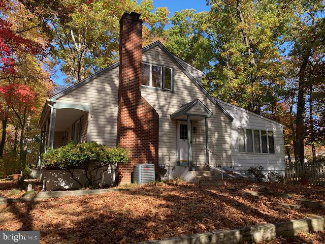 349 Hartford Rd, Mount Laurel, NJ 08054 - view of front facade featuring a chimney