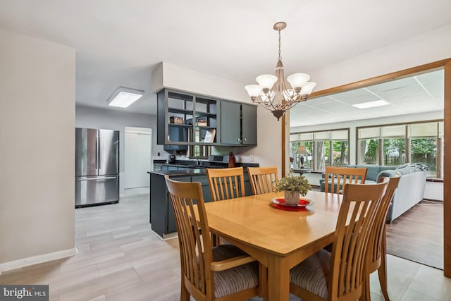 349 Hartford Rd, Mount Laurel, NJ 08054 - dining room with a chandelier and baseboards