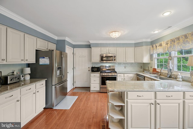 11115 Sceptre Ridge Ter, Germantown, MD 20876 - kitchen with stainless steel appliances, crown molding, light wood-style floors, open shelves, and decorative backsplash