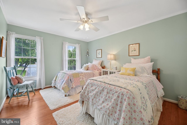 11115 Sceptre Ridge Ter, Germantown, MD 20876 - bedroom featuring ornamental molding, wood finished floors, and a ceiling fan