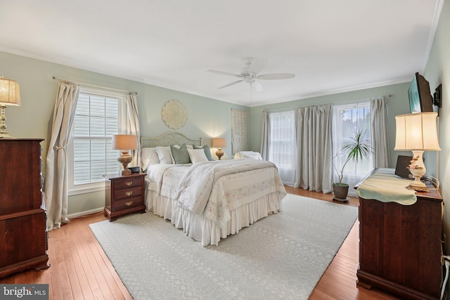 11115 Sceptre Ridge Ter, Germantown, MD 20876 - bedroom with light wood-style flooring, ornamental molding, and a ceiling fan