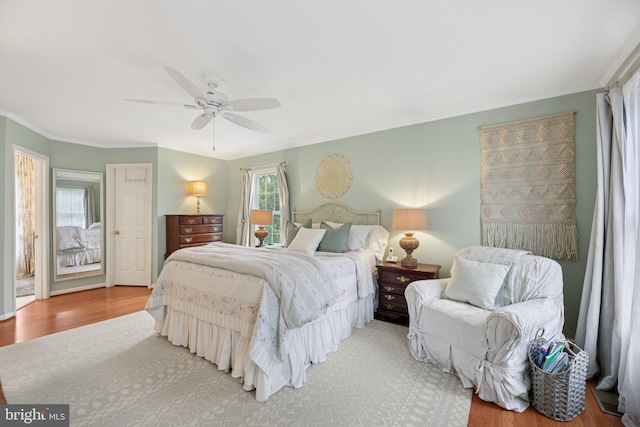 11115 Sceptre Ridge Ter, Germantown, MD 20876 - bedroom with light wood-type flooring, ornamental molding, and ceiling fan