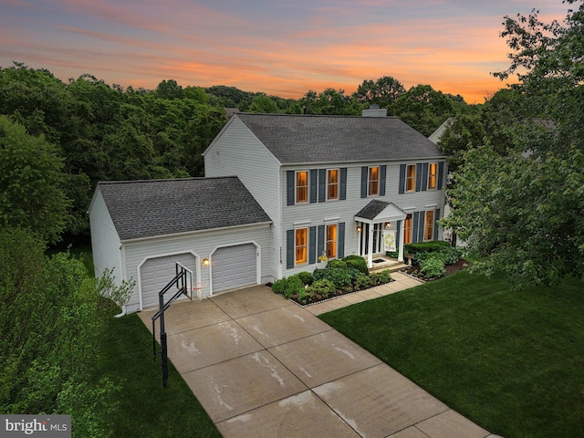 11115 Sceptre Ridge Ter, Germantown, MD 20876 - colonial home featuring a lawn, a garage, driveway, roof with shingles, and a chimney