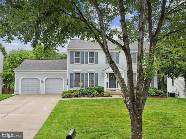 11115 Sceptre Ridge Ter, Germantown, MD 20876 - colonial-style house featuring an attached garage, concrete driveway, a front lawn, and roof with shingles