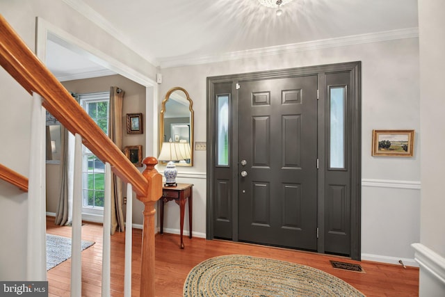 11115 Sceptre Ridge Ter, Germantown, MD 20876 - foyer featuring stairs, wood finished floors, and ornamental molding