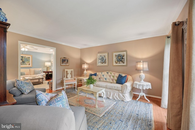 11115 Sceptre Ridge Ter, Germantown, MD 20876 - living area featuring wood finished floors and ornamental molding