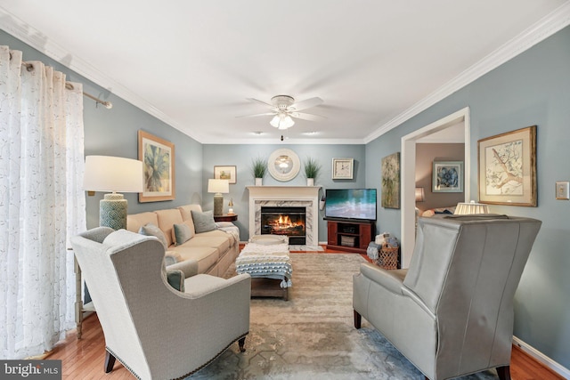 11115 Sceptre Ridge Ter, Germantown, MD 20876 - living area with ceiling fan, ornamental molding, a high end fireplace, and wood finished floors